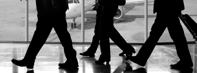 Business travellers walking through an airport